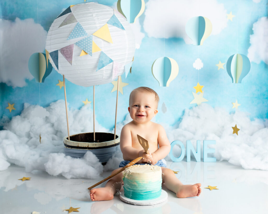 Playful balloon setup for a smash photoshoot, capturing fun moments from a 1st birthday celebration.