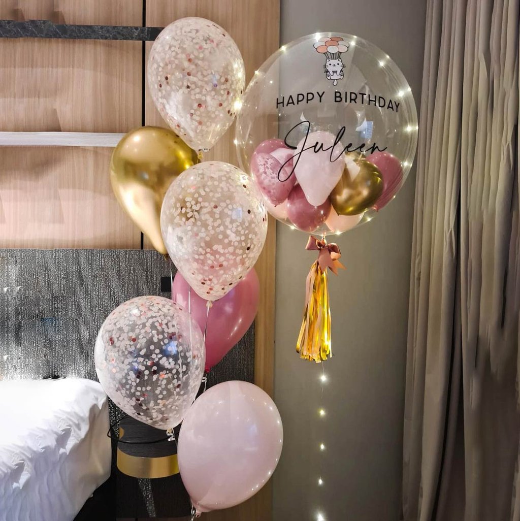Custom balloon bouquets with the child’s name and age for a vibrant 1st birthday celebration.