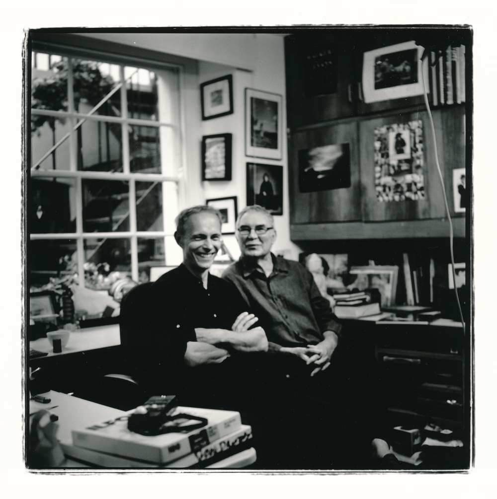 Adrian Ensor and Slawek Dejneka a black and white analogue picture of them sitting on chairs. Author: Slawek Dejneka
