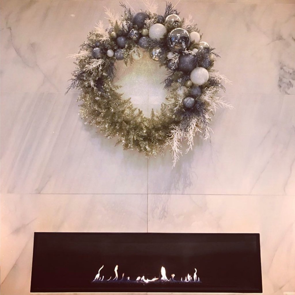 Andy Albright's wreath design hanging on a wall.