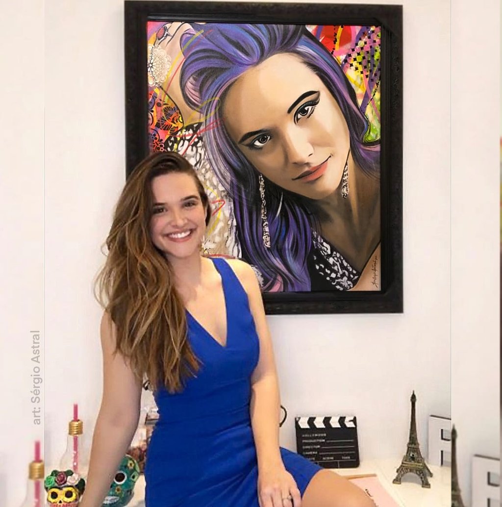 Contemporary pop-art works adorn the gallery walls.