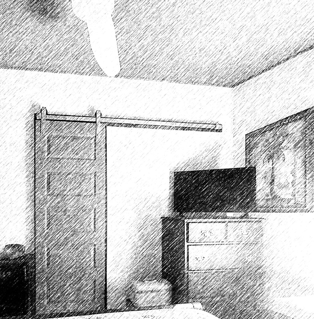 a bedroom with a bed and a television