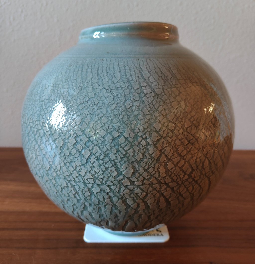 finished wheel-thrown moon jar with sodium silicate crack pattern and celadon glaze