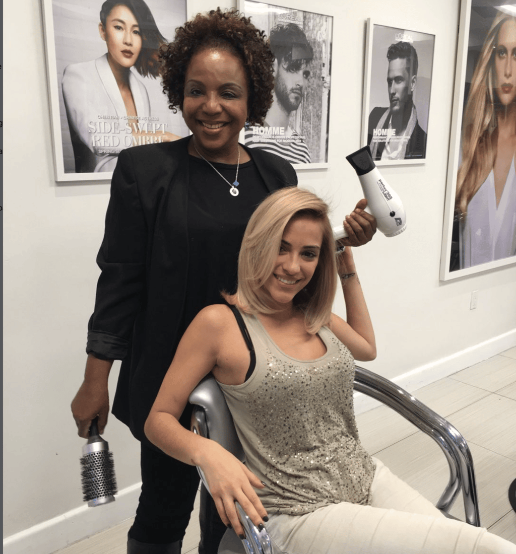 Finished layered haircut with soft waves by Francis Hair & More in Miami