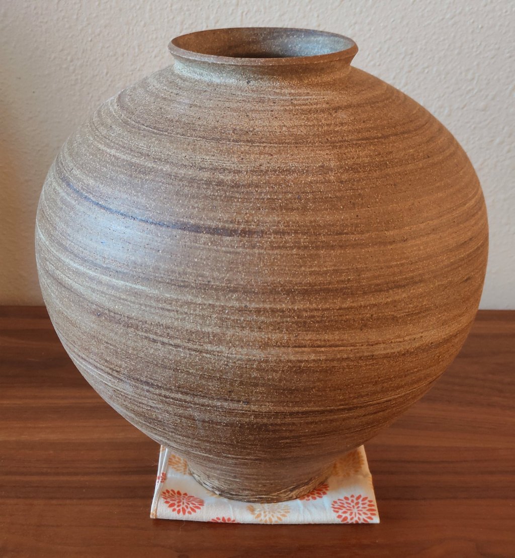 finished large wheel-thrown moon jar using marbled clay