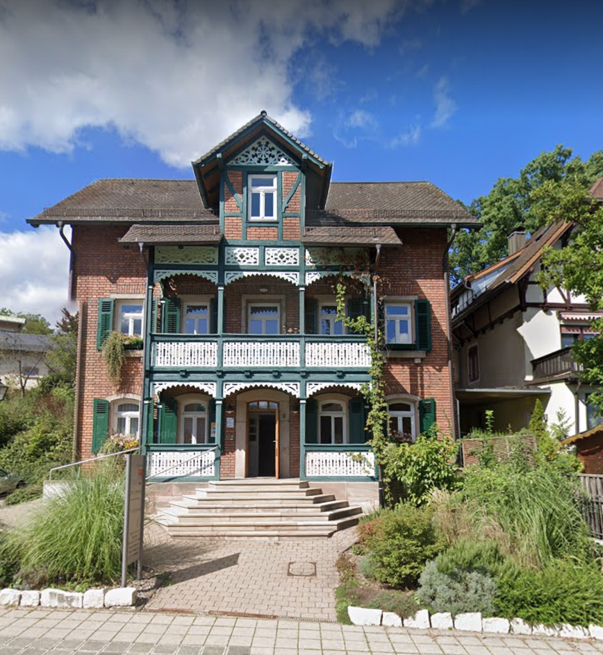 a large house with a brick building and a brick building