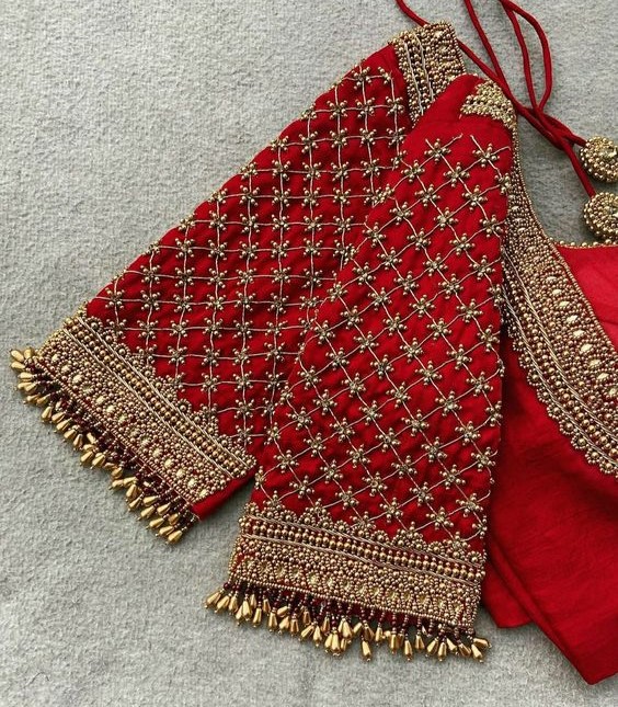 aari work red blouse with hand full of design