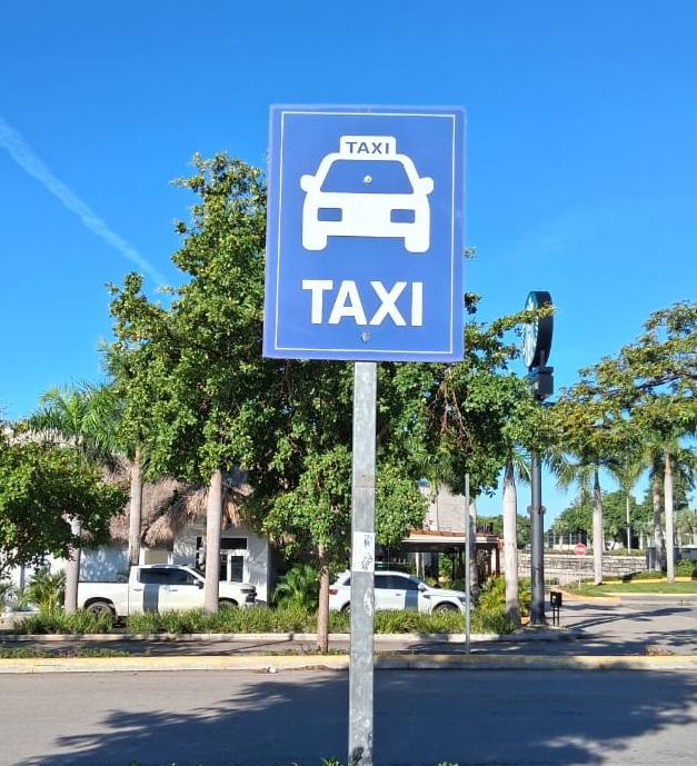 Taxi stand sign on a sunny street in the Dominican Republic