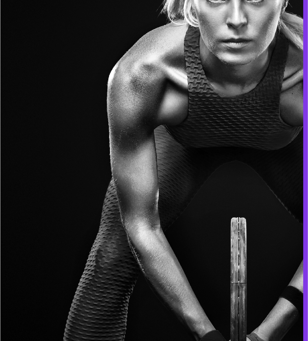 a woman in a sports bra and a tennis racket