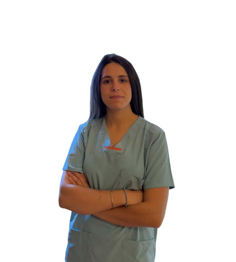 a woman in scrubs and scrubs standing in front of a white wall