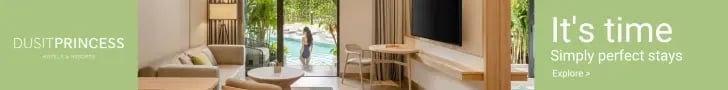 Luxury hotel suite at Dusit Princess with a pool view, modern furniture, and lounge area.