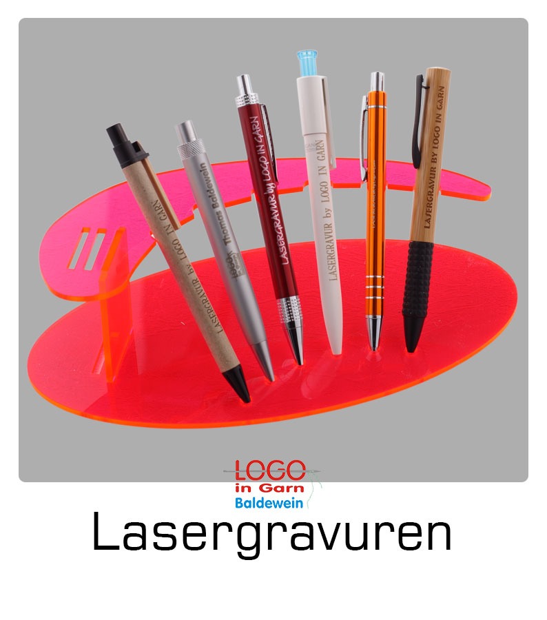 a group of pens and pens sitting on a table