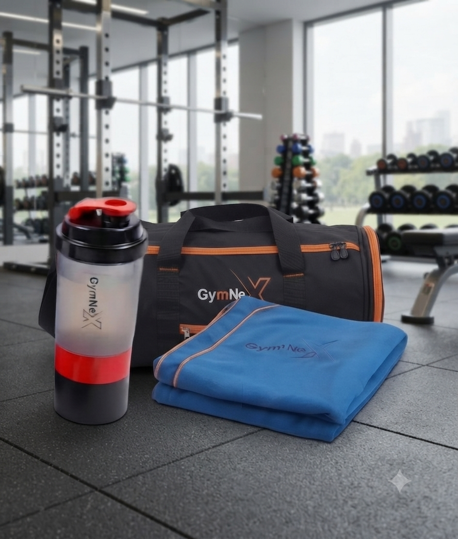Gym bag, blue microfiber towel, and protein shaker bottle on a fitness center floor.