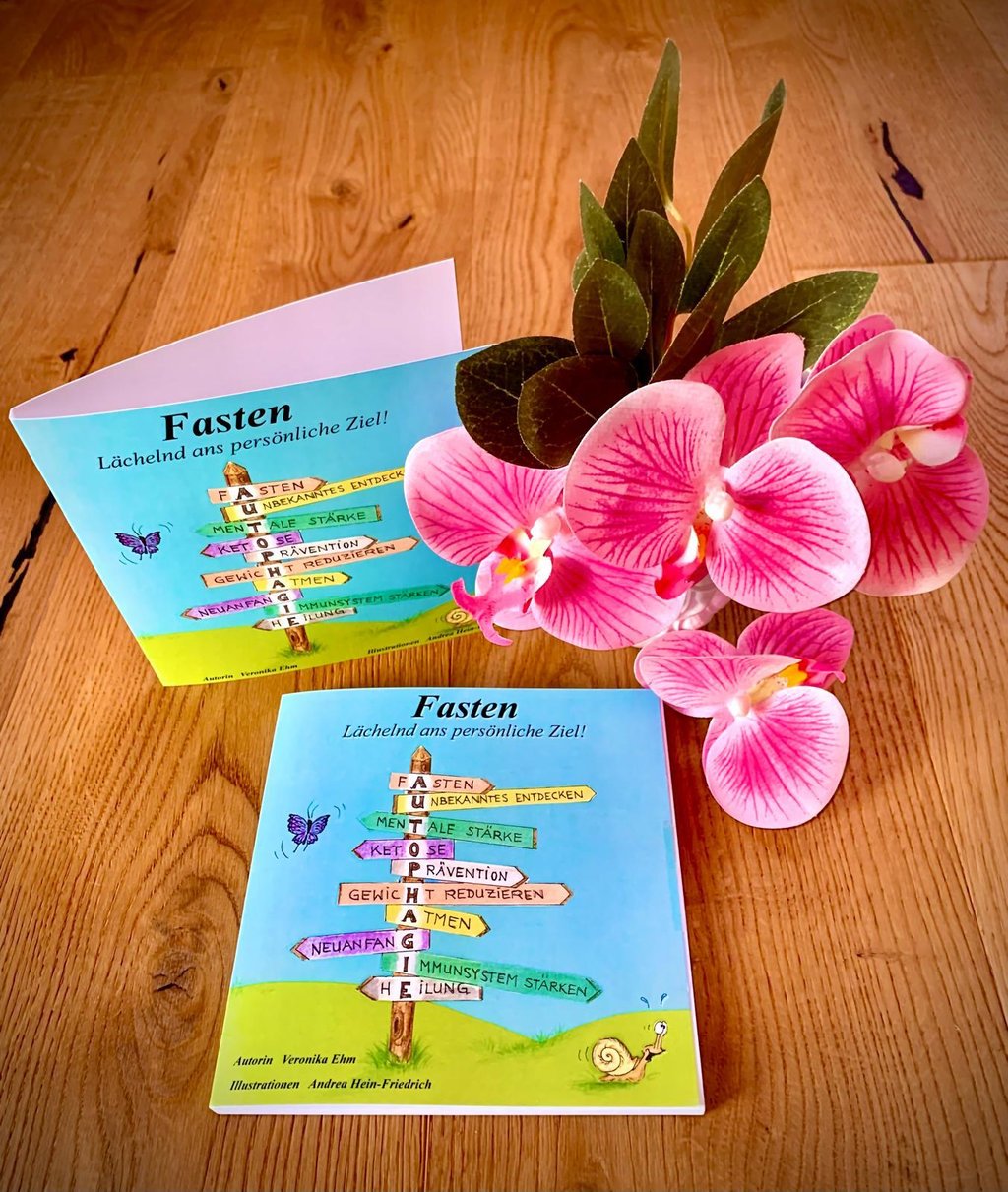 a book with a flower and a bookmark on it