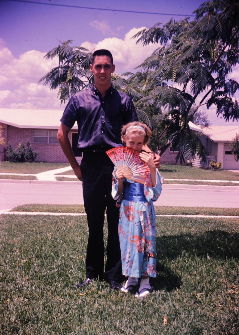 Vintage photograph of a young Art Rainbolt standing beside his little sister who is wearing a kimono