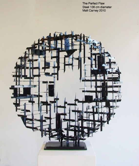 a steel cross-hatched  circle sculpture  