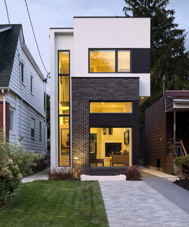 a house with a large window and a small patio