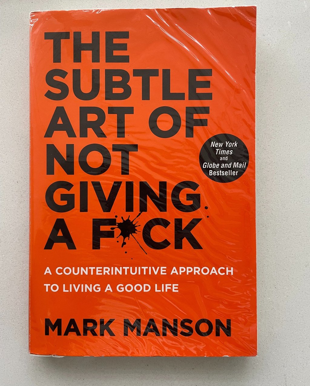 a book cover of the book the subtle art of not giving a Fuck