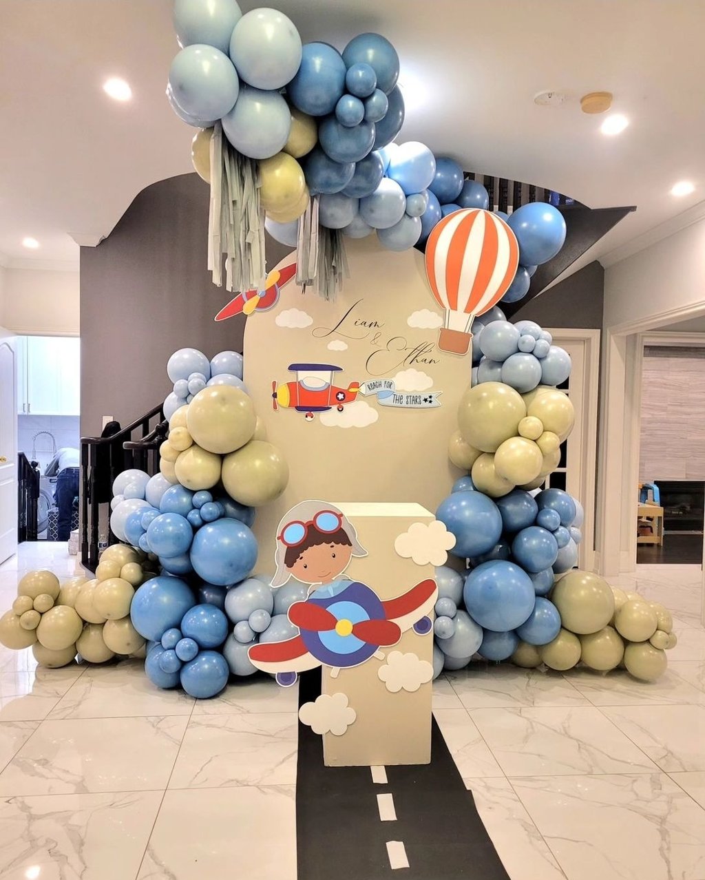 Airplane themed balloon backdrop for two brothers