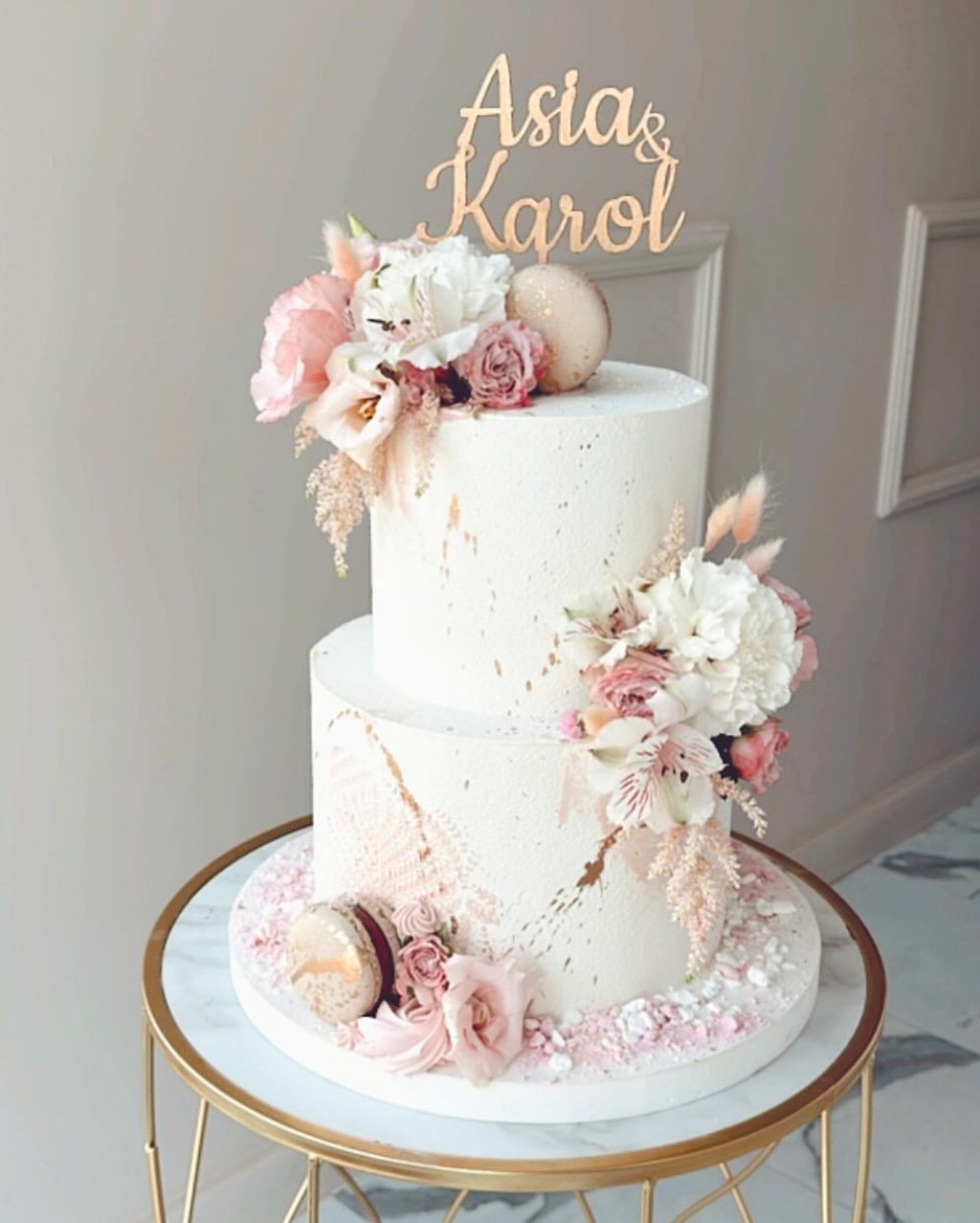 a white cake with a gold cake topperf