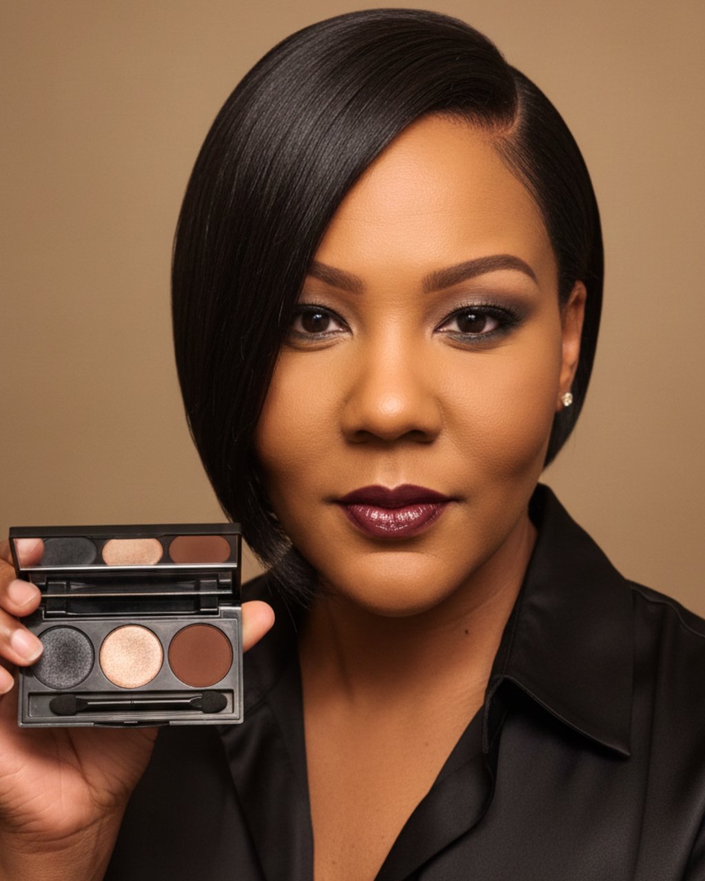 Woman with dark lipstick holding a professional three-color eyeshadow makeup palette.