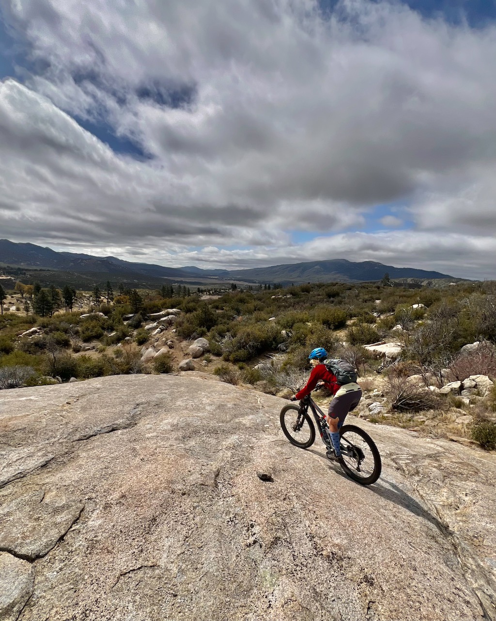 a person riding a bike on a rocky surface