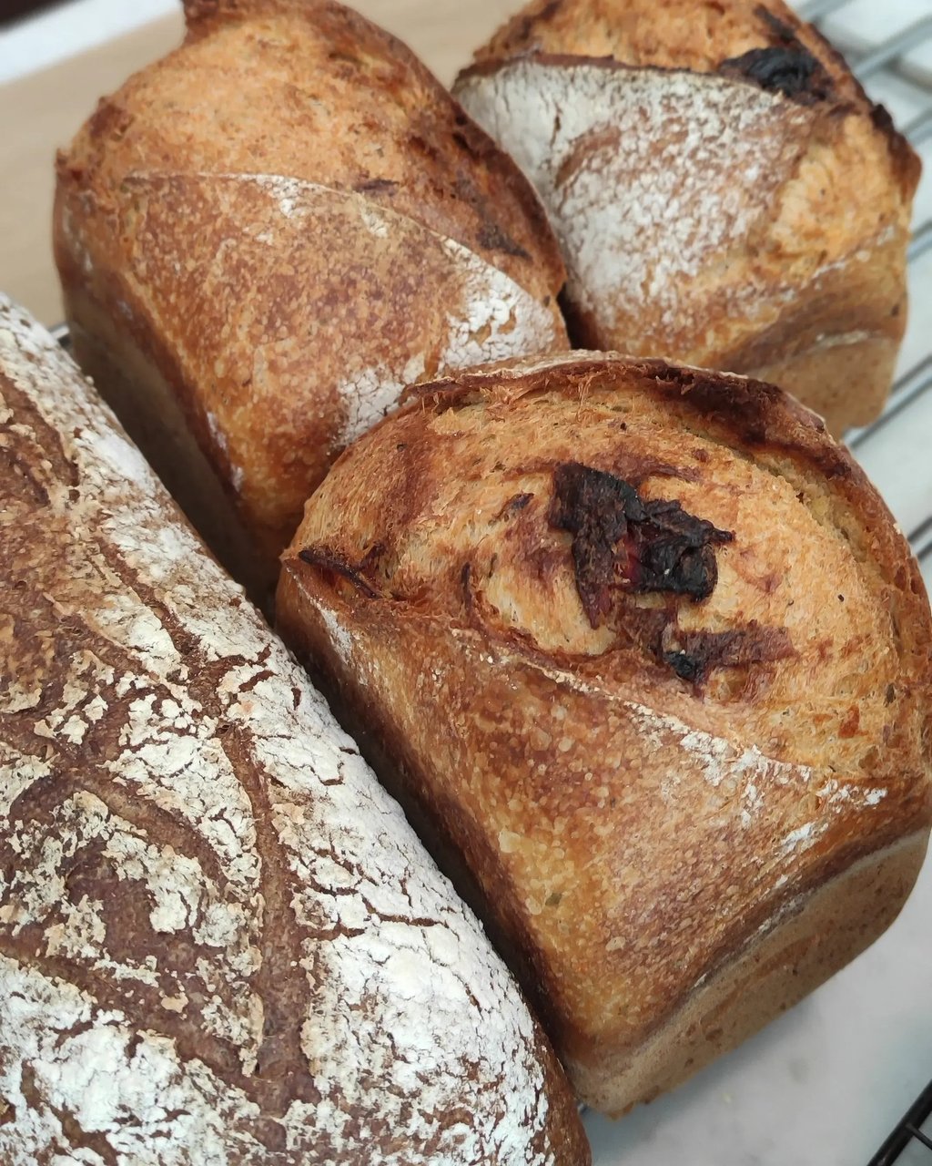 a bunch of breaded breaded breads on a cooling rack