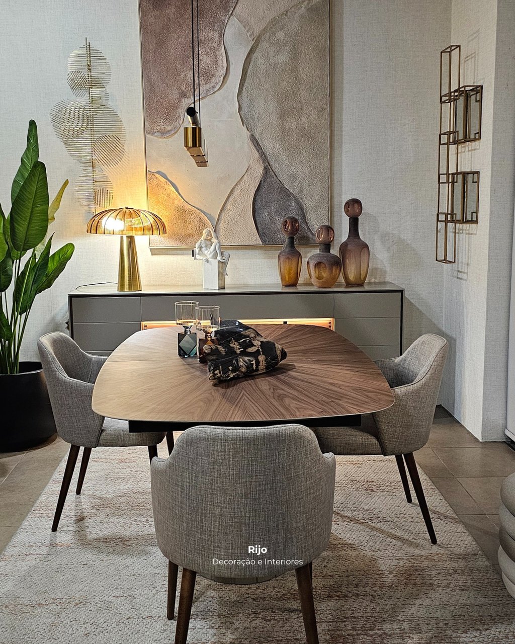 Modern dining room set with walnut table, gray upholstered chairs, and abstract wall art.