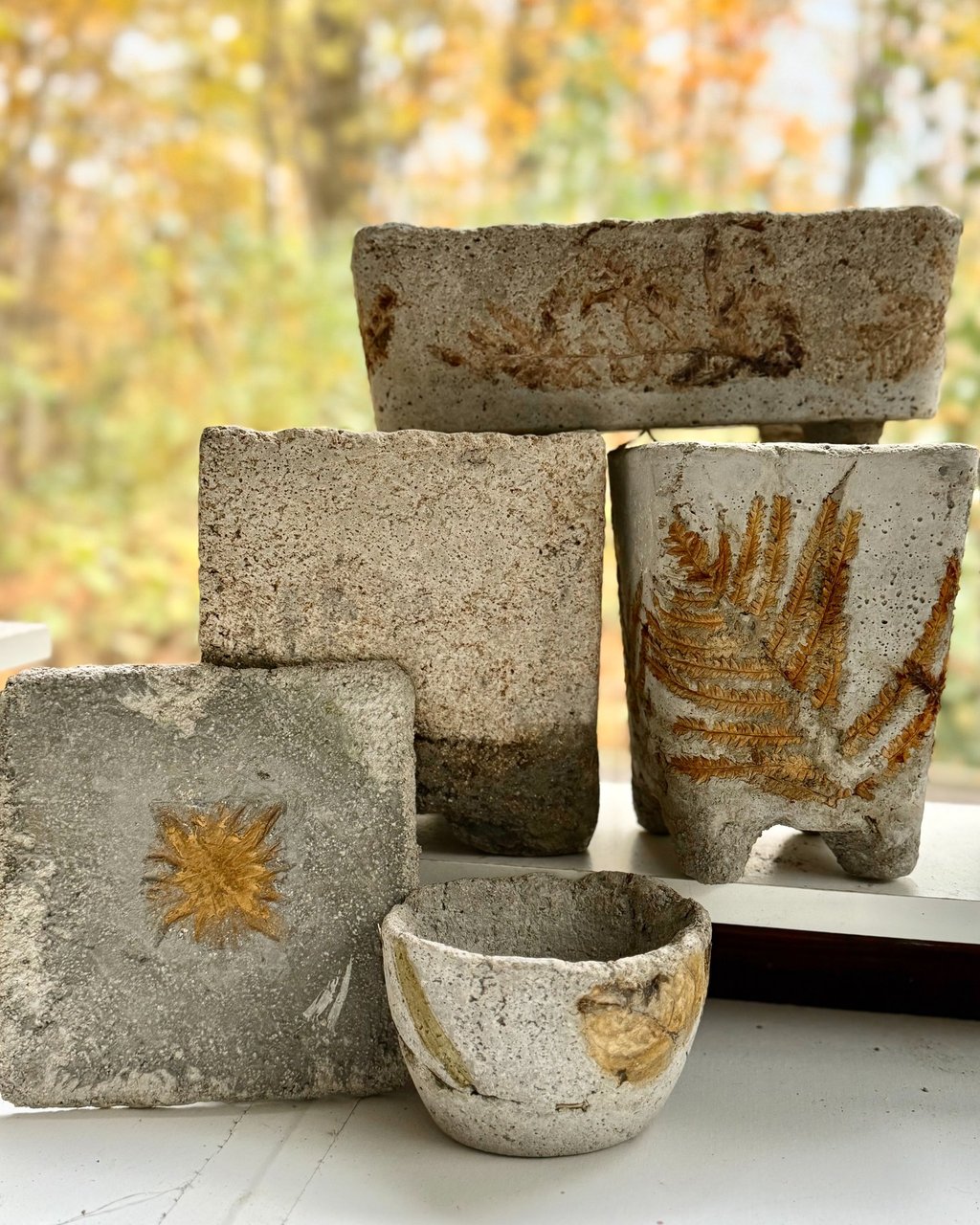 Selection of lightweight cement hypertufa garden pots and vessels.