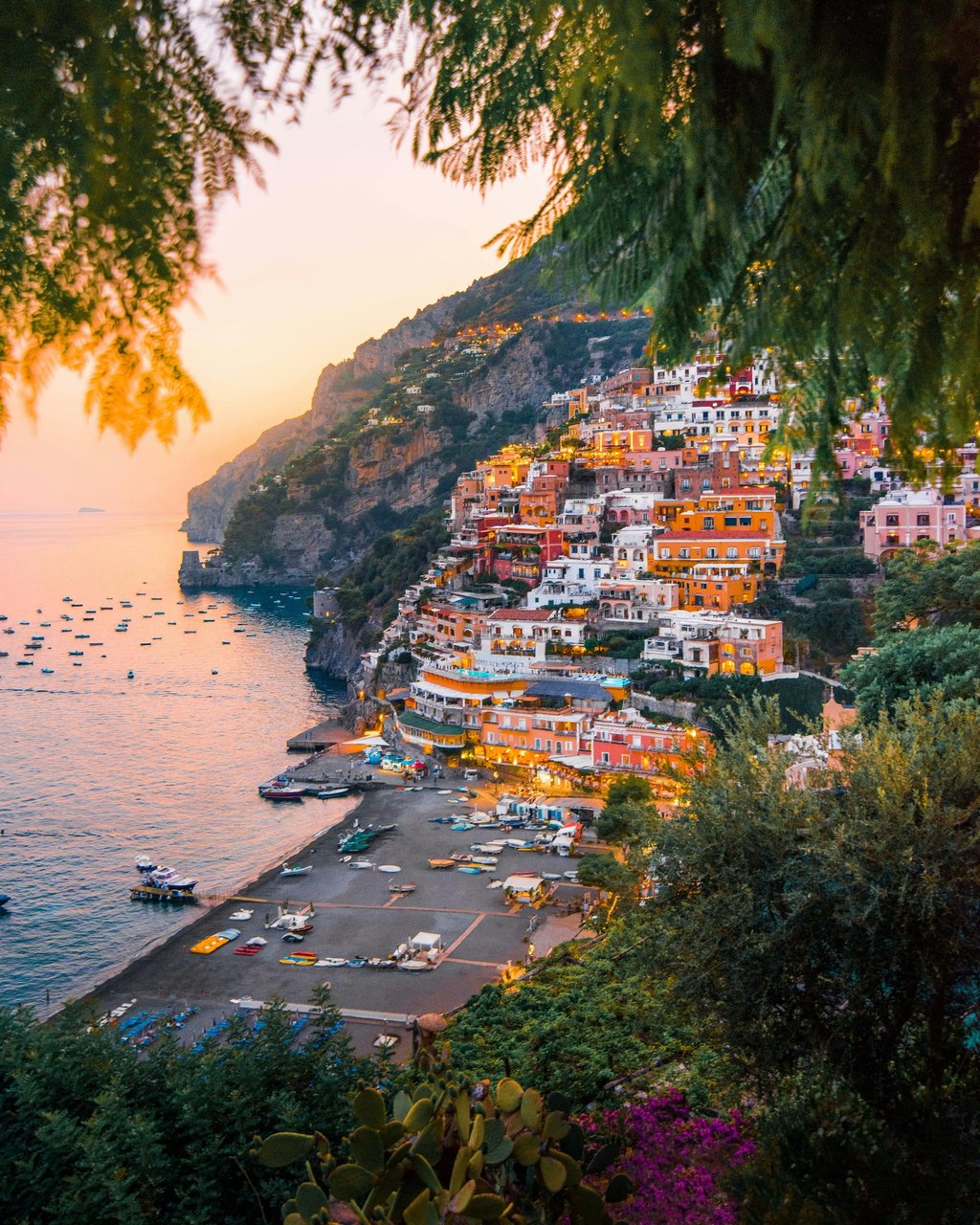 Colourful hillside village in Amalfi coast, at sunset overlooking the sea.