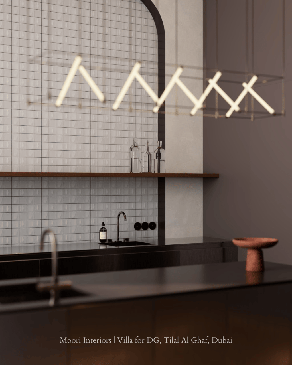 Contemporary kitchen design featuring a dark countertop and illuminated by a linear light fixture.