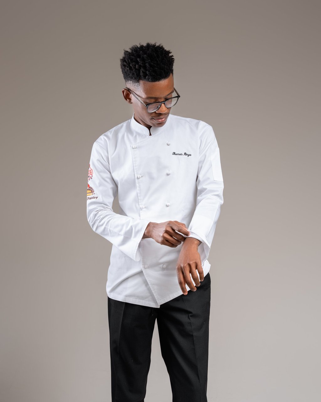 a man in a white shirt and black pants