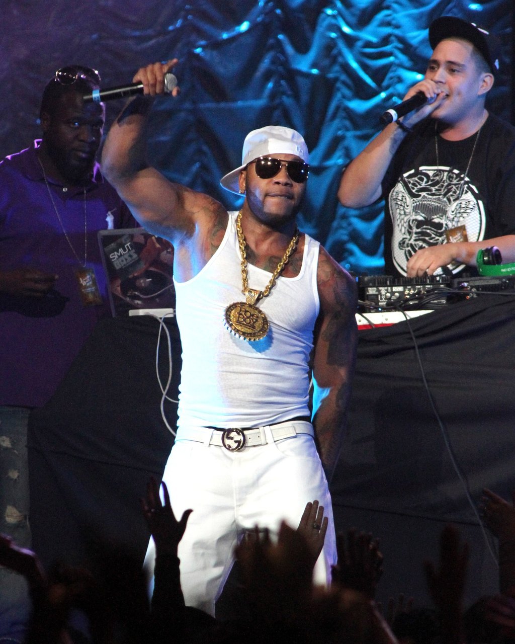flo rida in white hat, white tank shirt and white pants performing