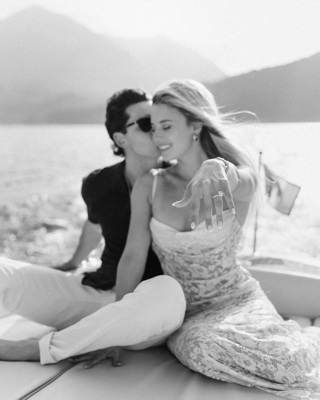 lindsay brewer show engagement ring in Lake Como