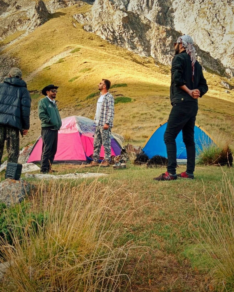 Tents set up on Khyber Sar Mountain with panoramic views of the Hunza Valley camping