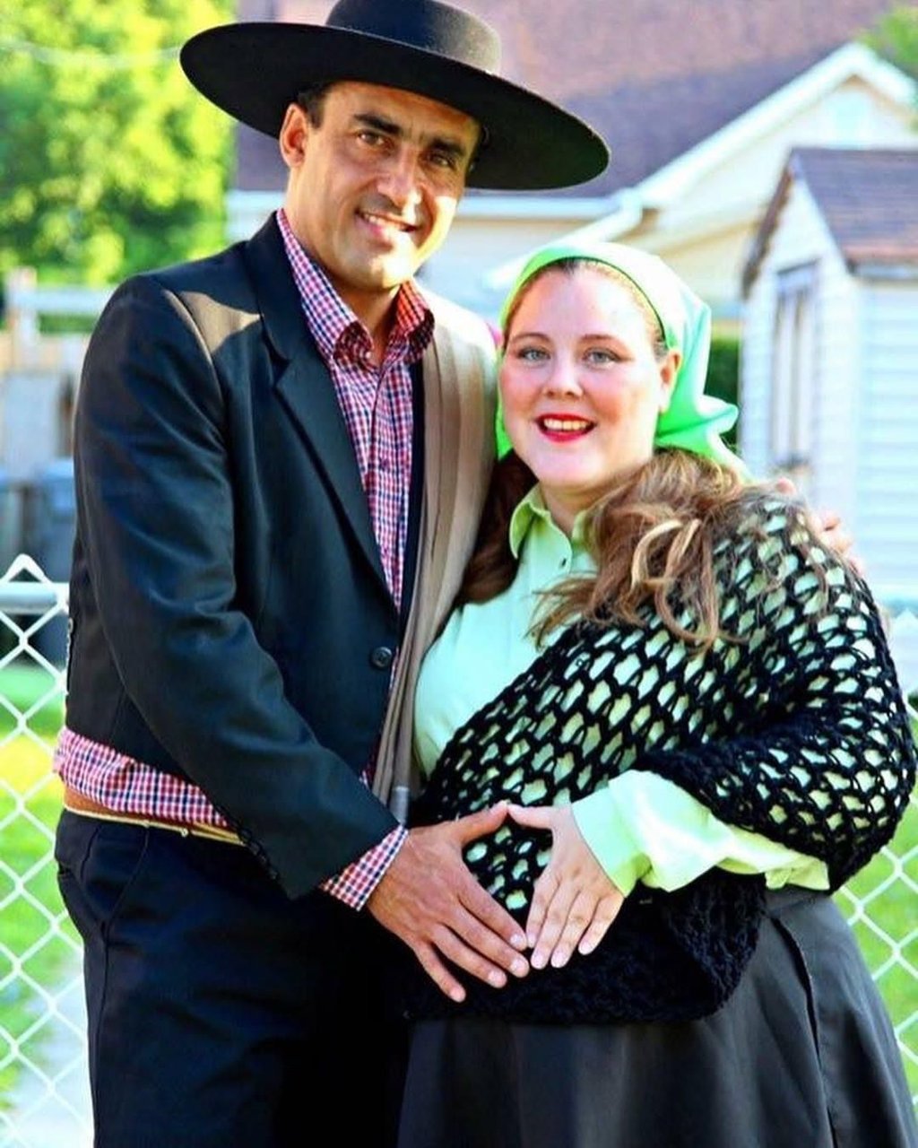 a man and woman in a Chilean hat and a black dress