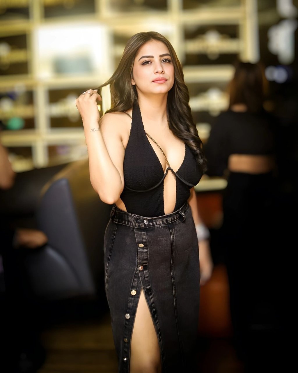 a woman in a black dress and a black dress