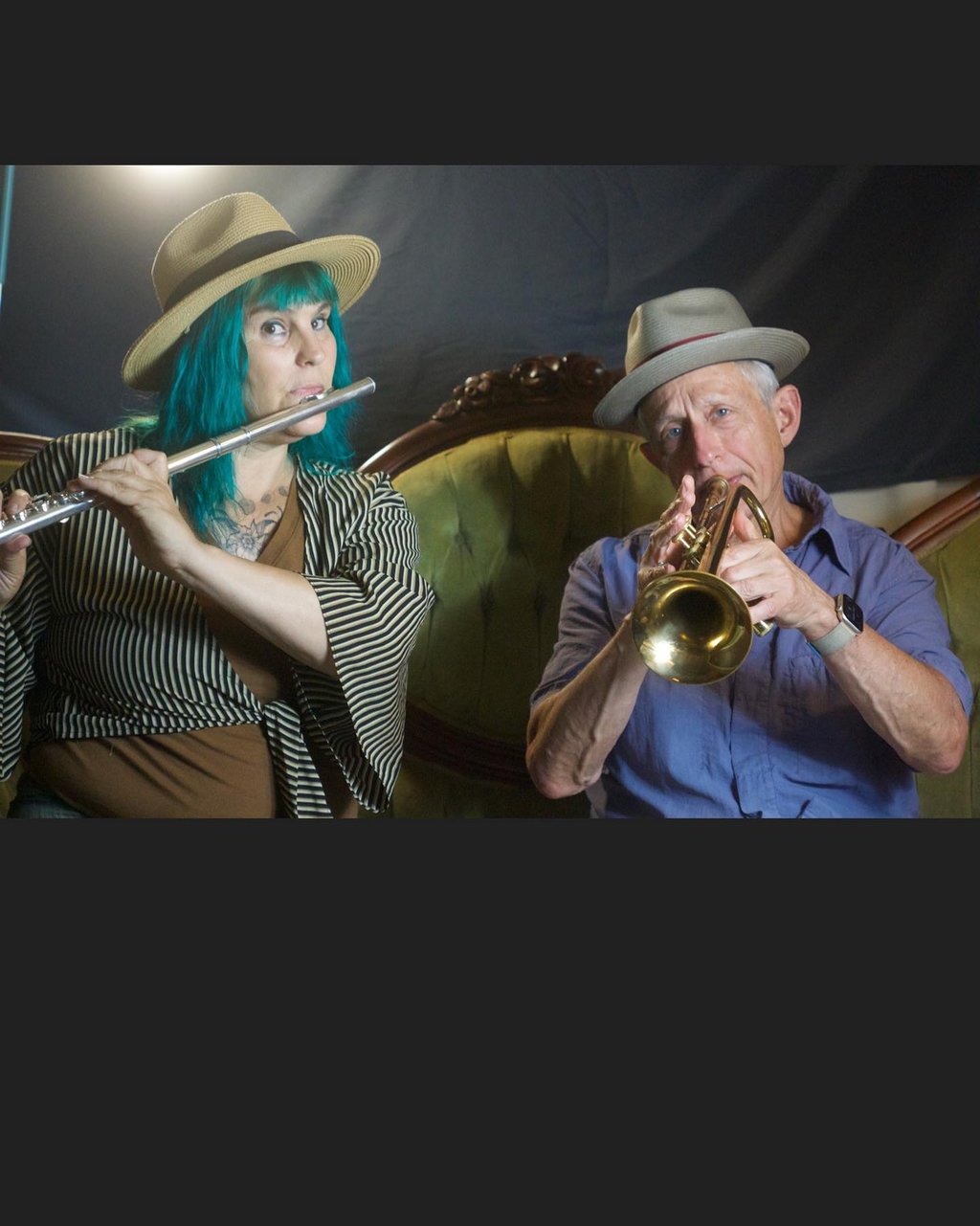 Two band members play music together