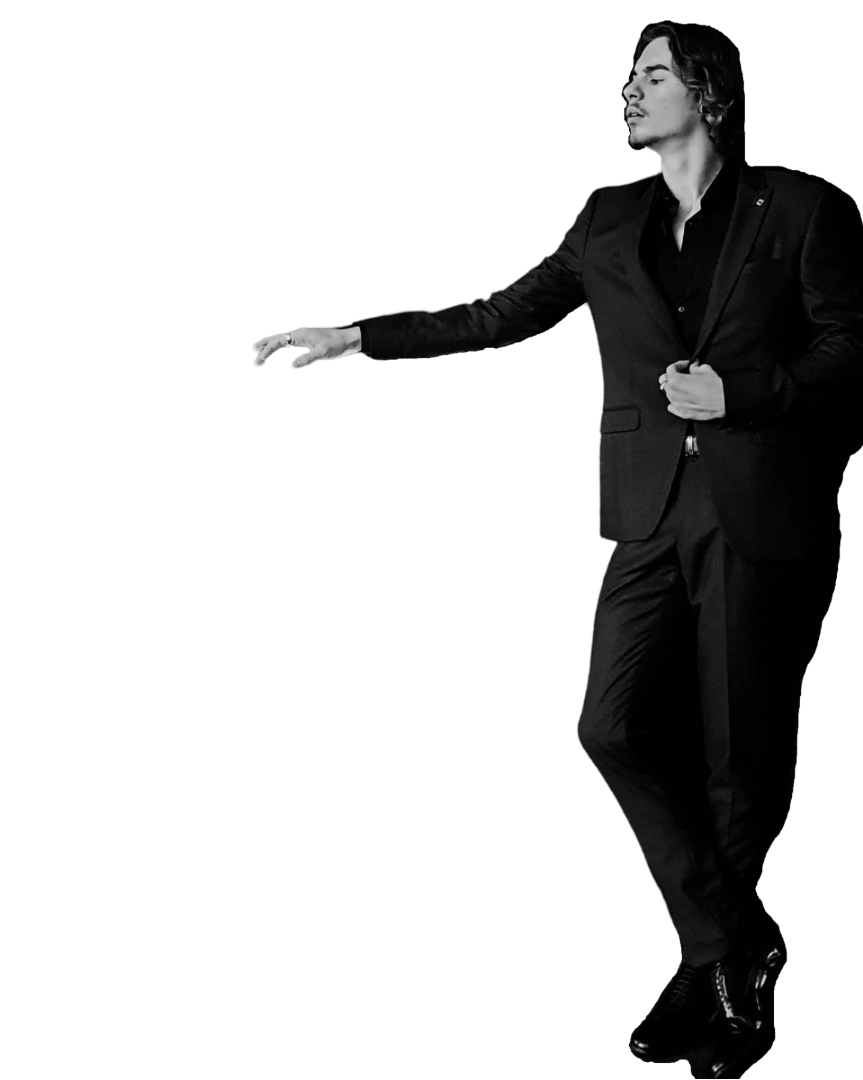 a man in a suit and shoes standing in a black and white photo