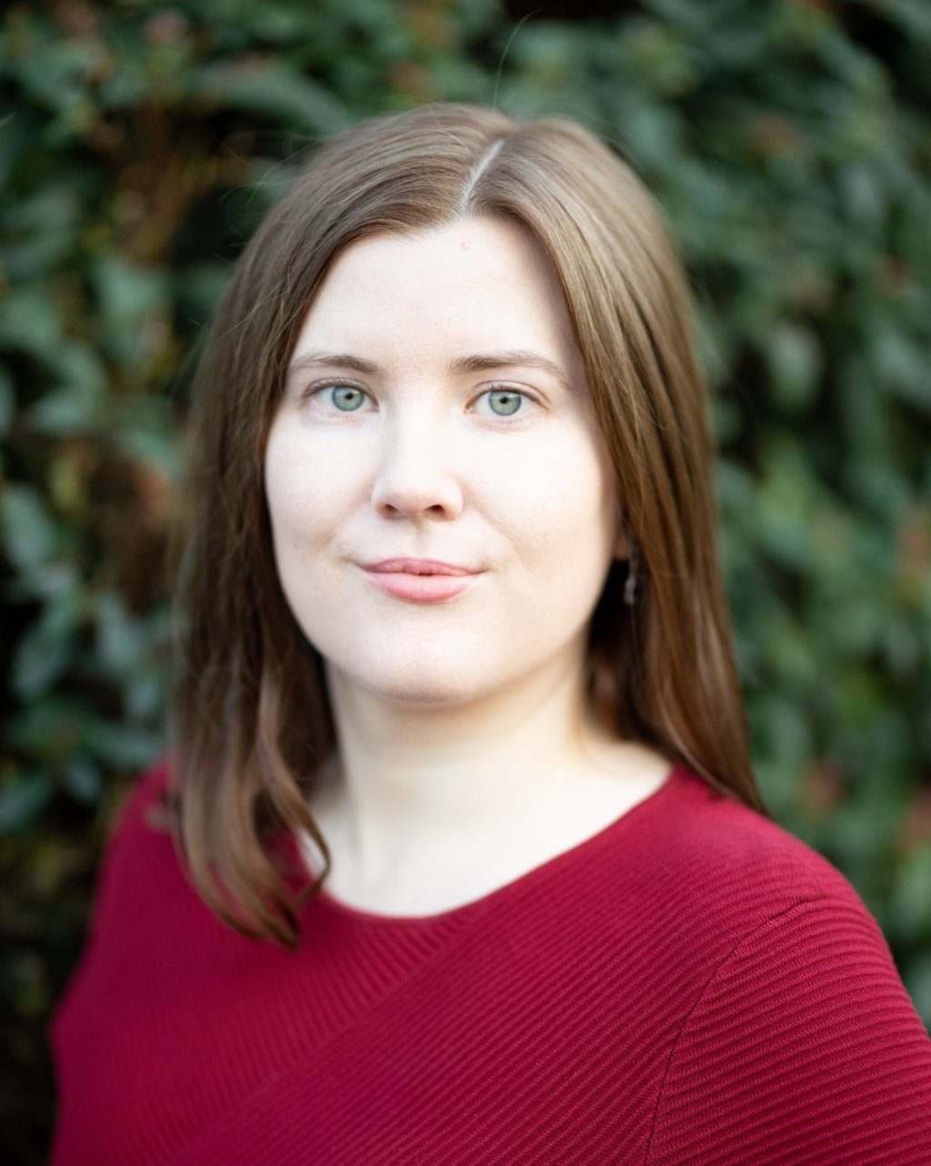 Adept Mediation professional compassionate female mediator looking at a client