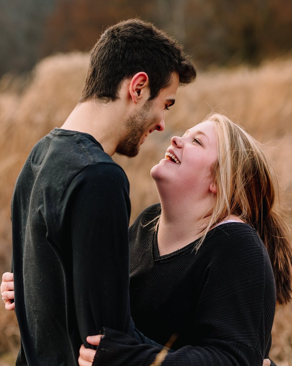 Young couple smiling at each other