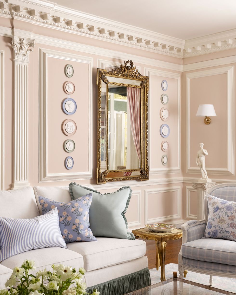 a living room with a couch and a mirror