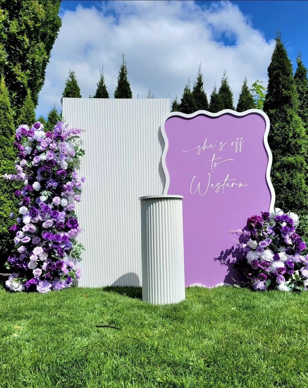Gradualtion party with a purple and white floral theme