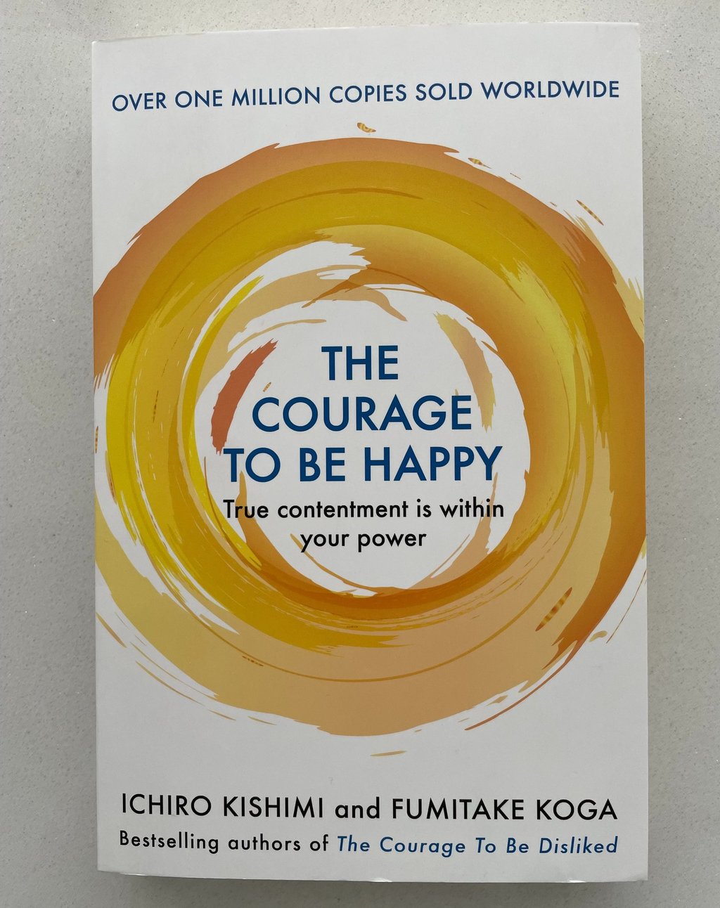 a book cover of the book the courage to be happy