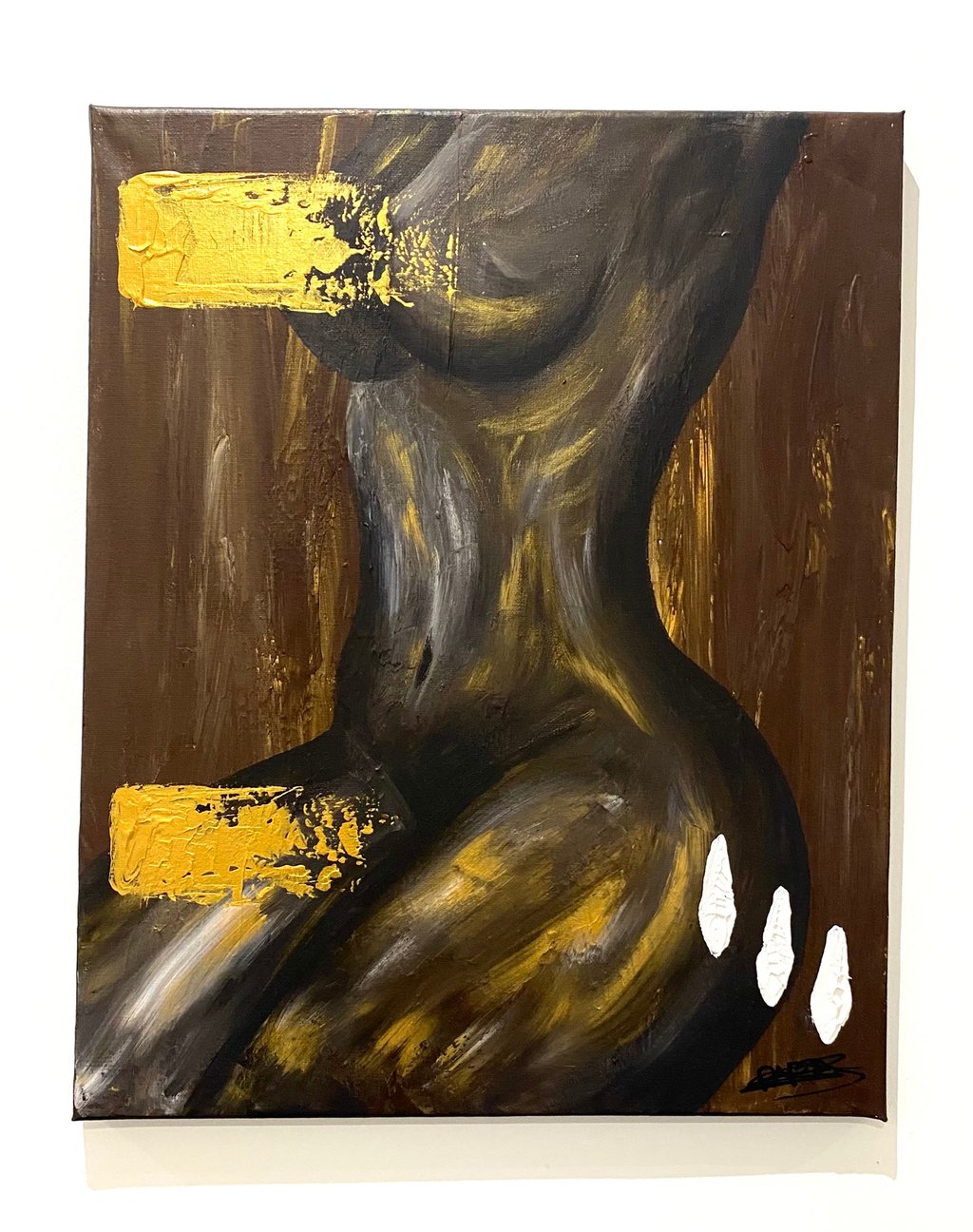 a painting of a woman's torso with gold