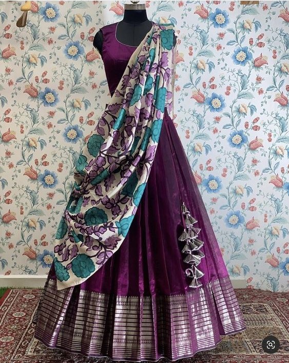 a purple and blue dress with a floral print on the bottom