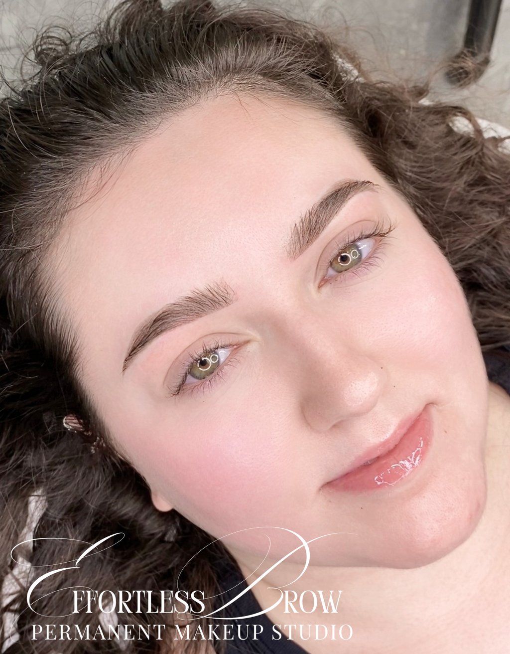 A view of symmetrical and softly defined ombre powder brows immediately after the service.