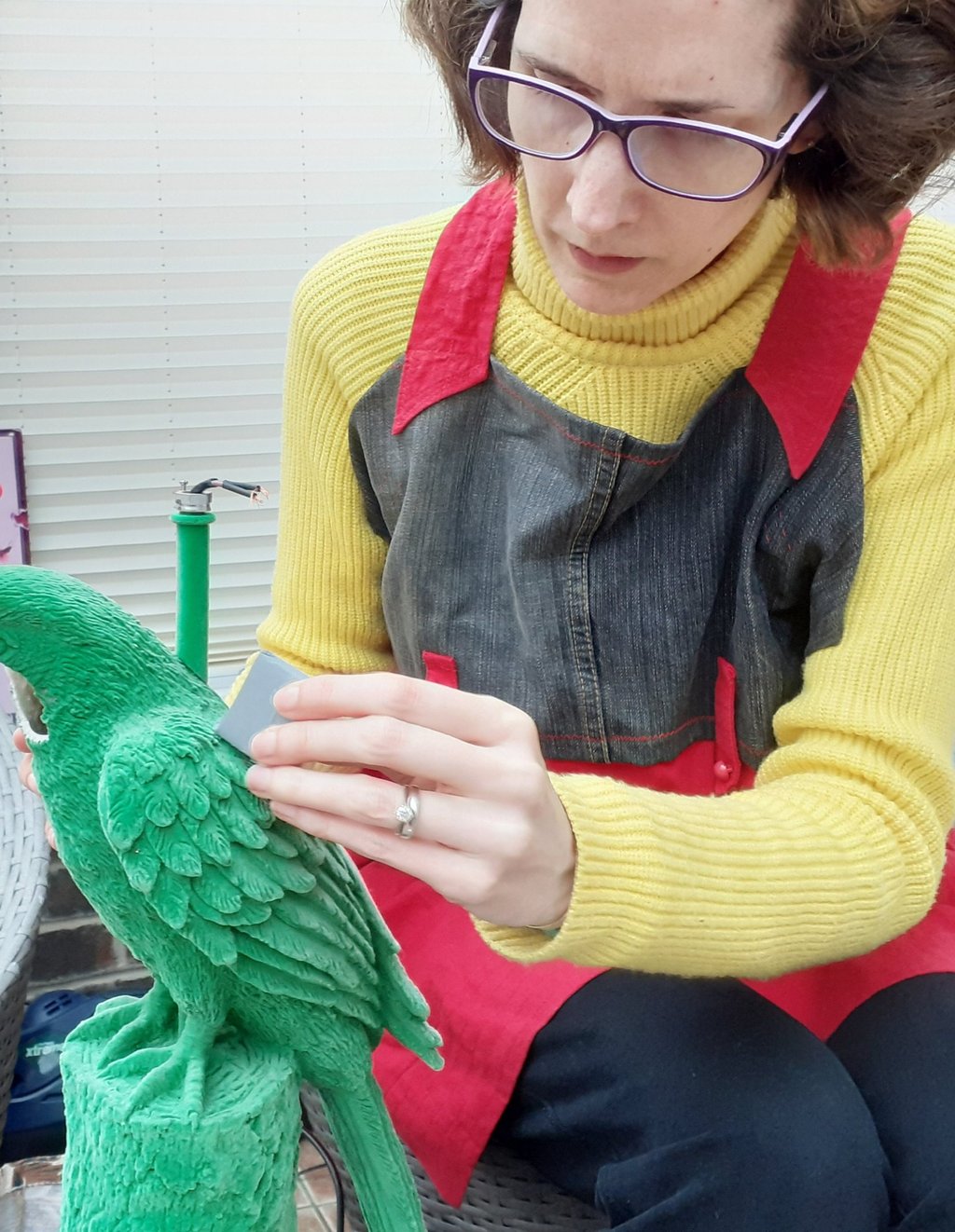 Mandy cleaning a plastic lamp base