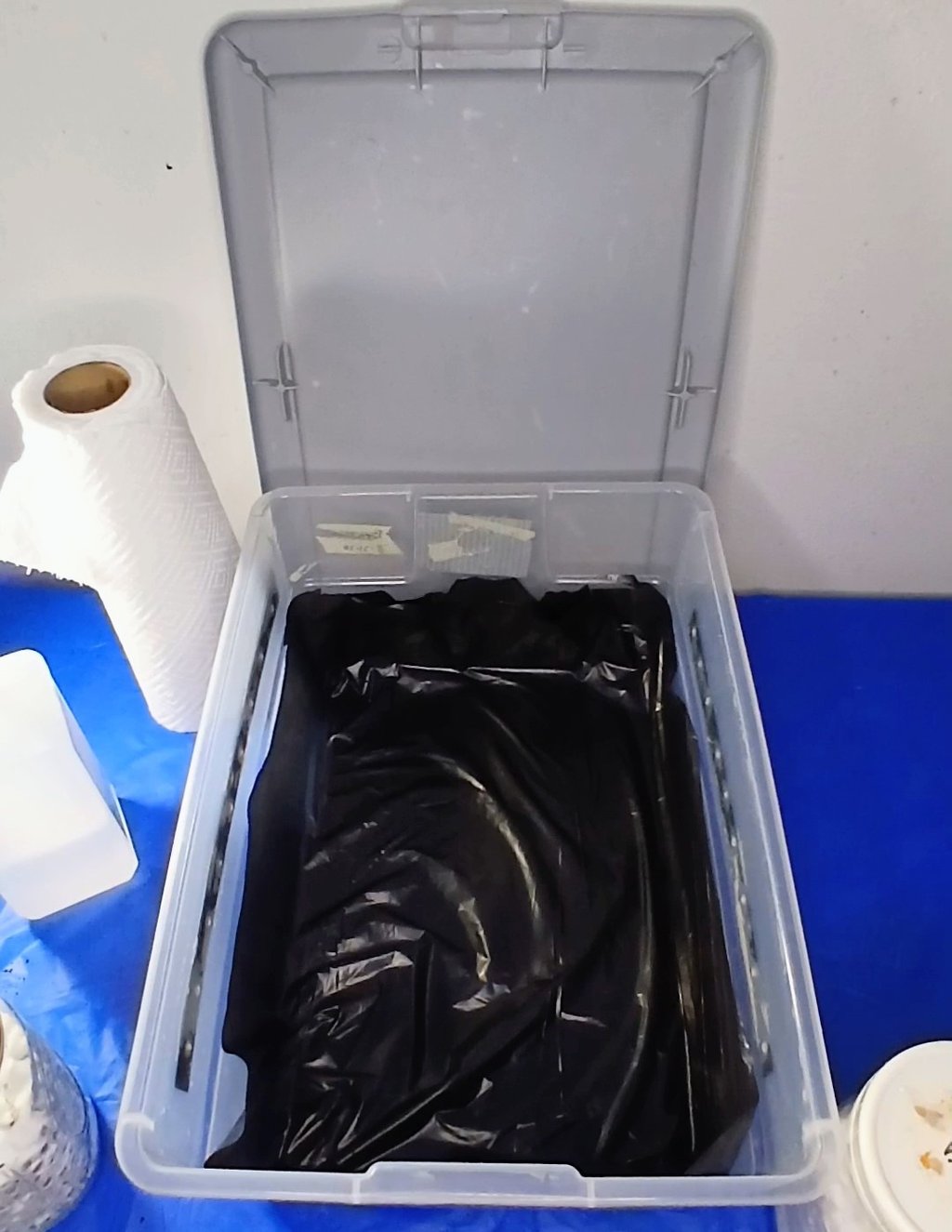 a tubbed lined with a black liner to prevent side pins in mushroom cultivation