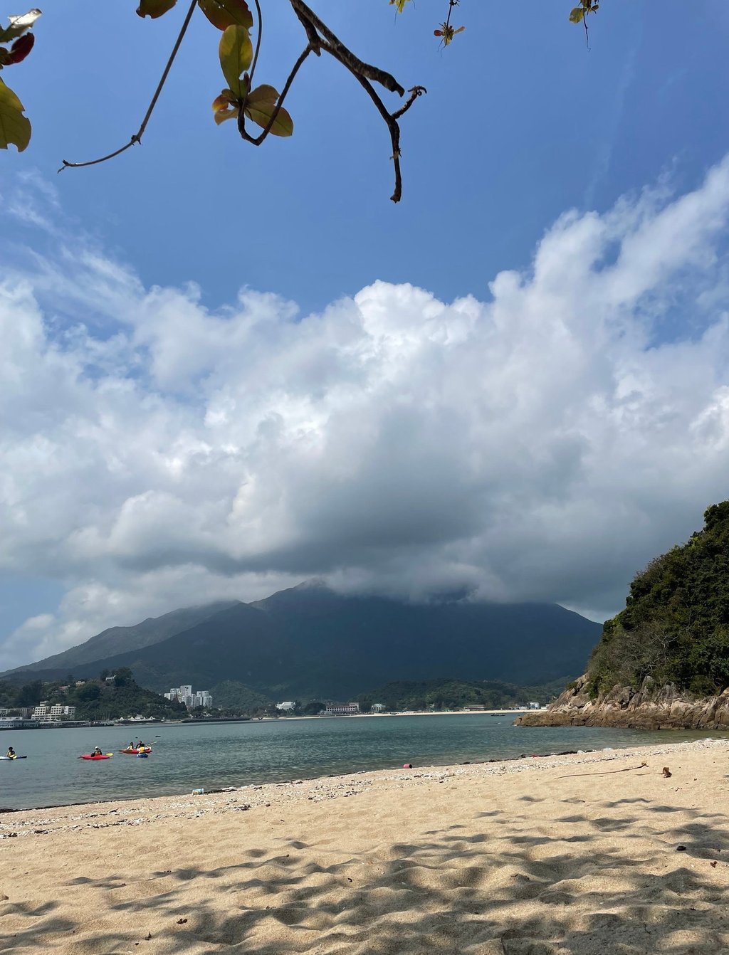 a beach with a mountain in the background
